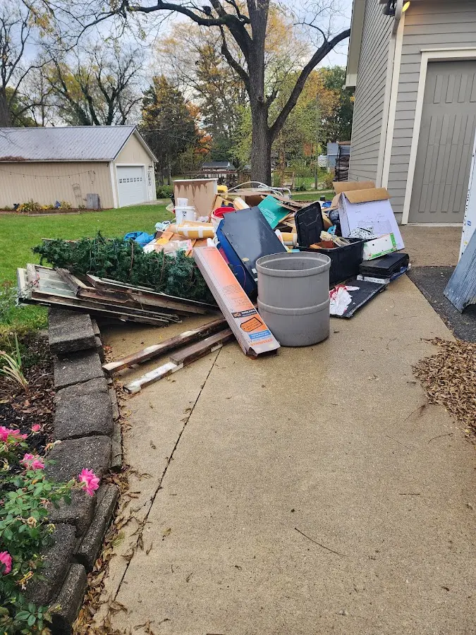 Dumpster being loaded with debris for Demolition Dumpster Rental in Bonny Doon